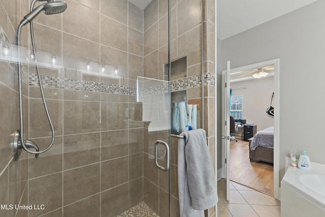 bathroom featuring a stall shower, tile patterned flooring, a garden tub, and ensuite bath