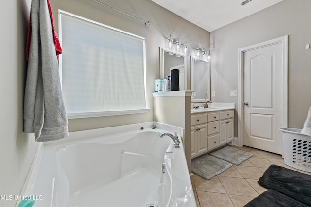 bathroom featuring a garden tub, visible vents, tile patterned flooring, and vanity