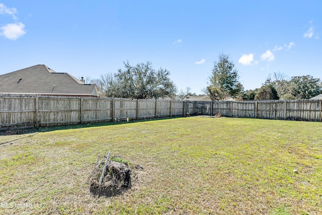 view of yard featuring a fenced backyard