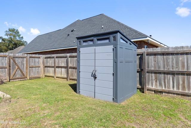 view of shed with a fenced backyard