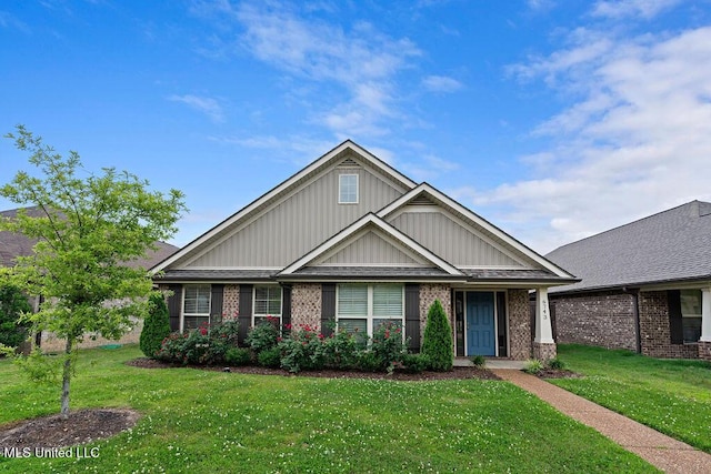 6743 Jessie Hoyt Dr, Olive Branch, MS 38654 - craftsman-style house with a front yard, board and batten siding, and brick siding