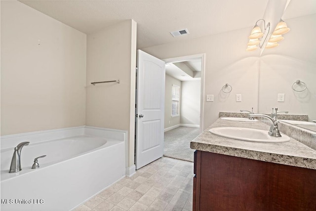 6743 Jessie Hoyt Dr, Olive Branch, MS 38654 - full bathroom featuring double vanity, a bath, and baseboards