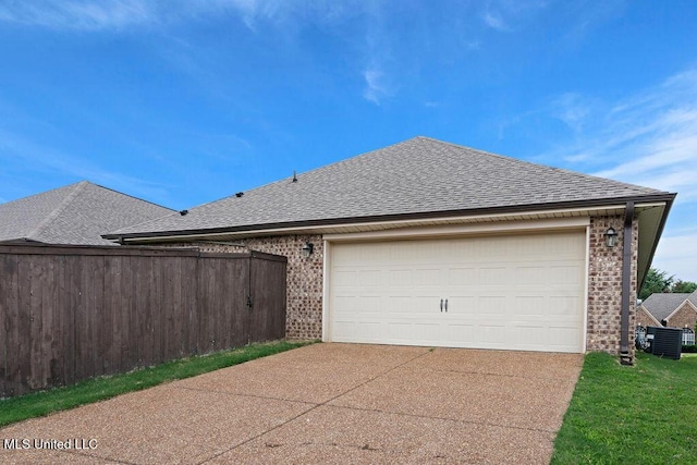 6743 Jessie Hoyt Dr, Olive Branch, MS 38654 - garage with driveway and central AC unit