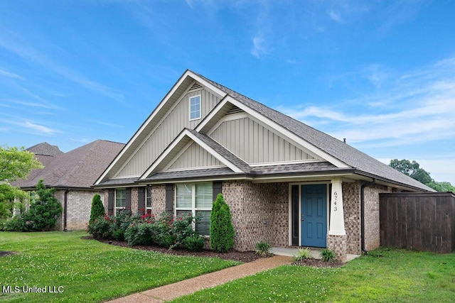 6743 Jessie Hoyt Dr, Olive Branch, MS 38654 - view of front of home featuring board and batten siding, brick siding, and a shingled roof
