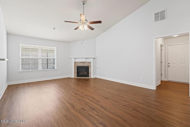 6743 Jessie Hoyt Dr, Olive Branch, MS 38654 - unfurnished living room with a ceiling fan, lofted ceiling, wood finished floors, a fireplace with flush hearth, and baseboards