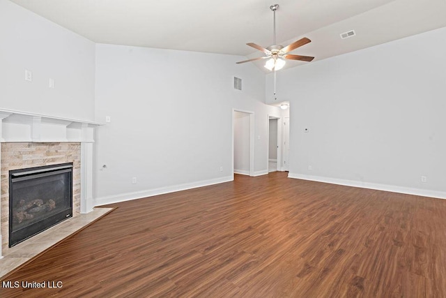 6743 Jessie Hoyt Dr, Olive Branch, MS 38654 - unfurnished living room with high vaulted ceiling, ceiling fan, a fireplace with flush hearth, wood finished floors, and baseboards