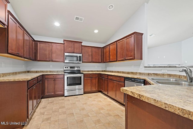 6743 Jessie Hoyt Dr, Olive Branch, MS 38654 - kitchen featuring appliances with stainless steel finishes, a sink, light countertops, lofted ceiling, and recessed lighting