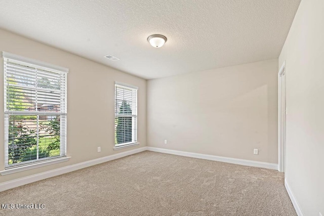 6743 Jessie Hoyt Dr, Olive Branch, MS 38654 - carpeted spare room with a textured ceiling and baseboards