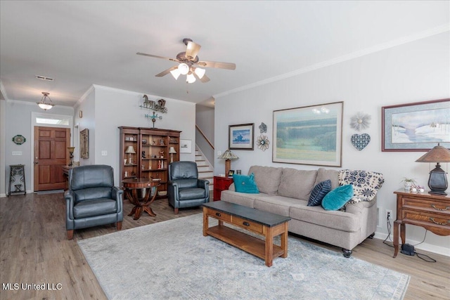 7199 Terrace Stone Dr, Olive Branch, MS 38654 - living area with baseboards, ornamental molding, wood finished floors, ceiling fan, and stairway