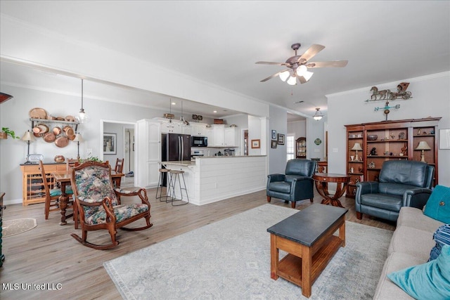7199 Terrace Stone Dr, Olive Branch, MS 38654 - living room with light wood-style flooring, ornamental molding, baseboards, and ceiling fan
