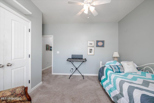 7199 Terrace Stone Dr, Olive Branch, MS 38654 - carpeted bedroom featuring baseboards, ceiling fan, and a textured ceiling