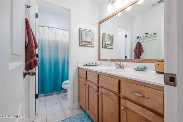 7199 Terrace Stone Dr, Olive Branch, MS 38654 - full bathroom with visible vents, tile patterned floors, toilet, and vanity
