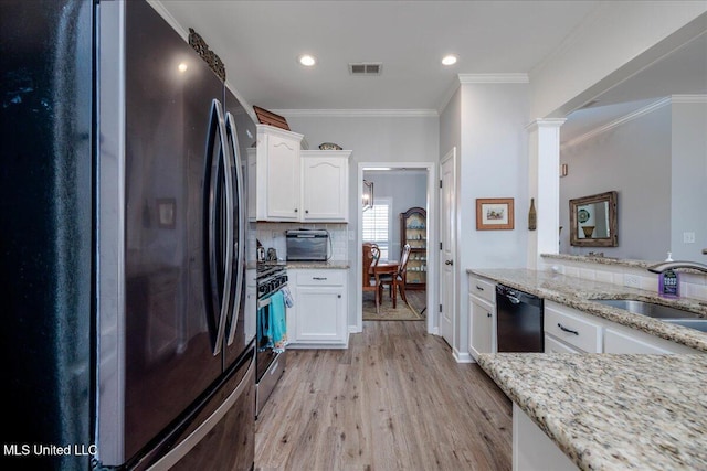 7199 Terrace Stone Dr, Olive Branch, MS 38654 - kitchen with white cabinets, a sink, appliances with stainless steel finishes, and visible vents