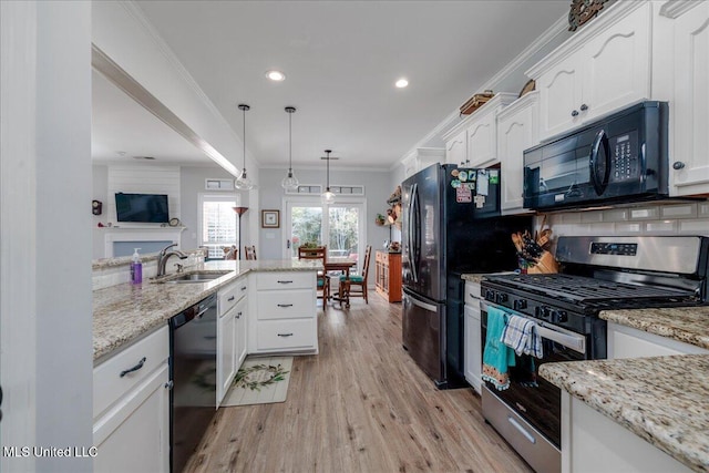 7199 Terrace Stone Dr, Olive Branch, MS 38654 - kitchen featuring a sink, white cabinets, black appliances, and ornamental molding