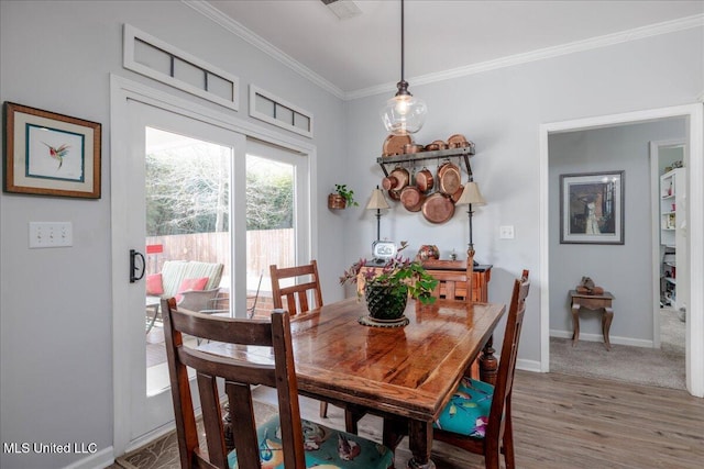 7199 Terrace Stone Dr, Olive Branch, MS 38654 - dining room featuring light wood finished floors, baseboards, and ornamental molding