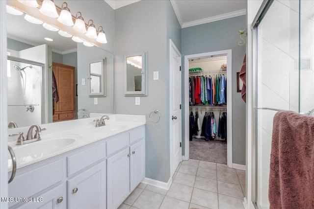 7199 Terrace Stone Dr, Olive Branch, MS 38654 - full bathroom featuring a sink, tile patterned flooring, crown molding, and a shower stall
