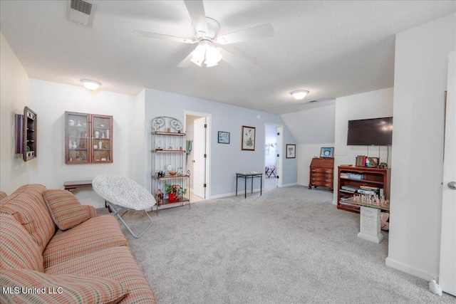 7199 Terrace Stone Dr, Olive Branch, MS 38654 - carpeted living area featuring a textured ceiling, visible vents, baseboards, a ceiling fan, and lofted ceiling