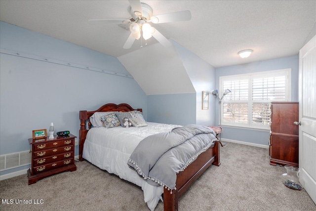 7199 Terrace Stone Dr, Olive Branch, MS 38654 - bedroom with a textured ceiling, visible vents, carpet, baseboards, and lofted ceiling