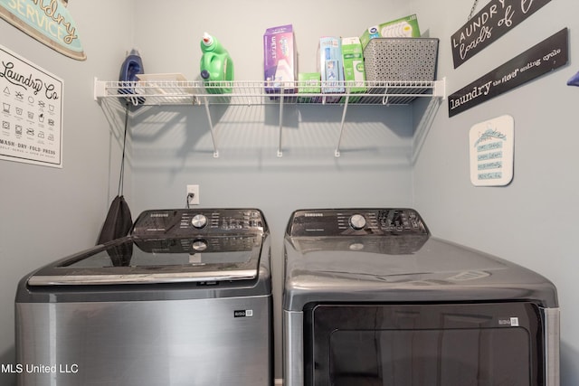 washroom with washer and dryer