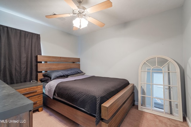 bedroom with light carpet and ceiling fan