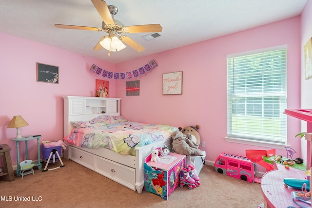 bedroom featuring multiple windows, carpet, and ceiling fan