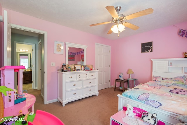 bedroom featuring light colored carpet, baseboards, and ceiling fan