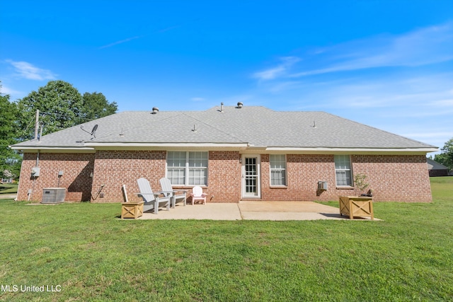 back of house with a patio, a lawn, brick siding, and a shingled roof
