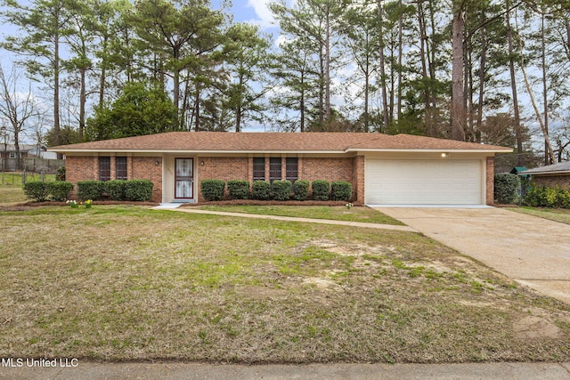 view of front facade with a front lawn, brick siding, driveway, and an attached garage