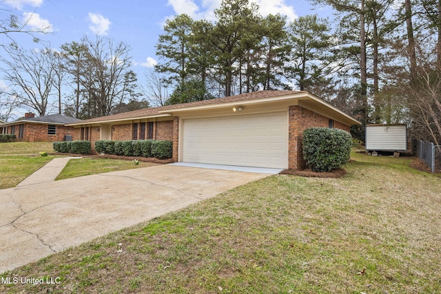 view of front of property with a garage, concrete driveway, brick siding, and a front lawn