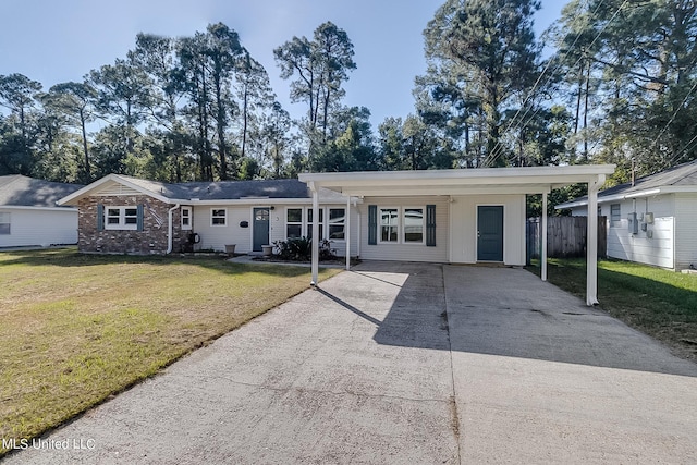 ranch-style home with a carport and a front lawn