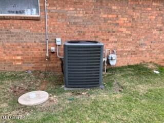 9091 Hunters Ridge Dr, Olive Branch, MS 38654 - exterior view of central AC unit and brick siding
