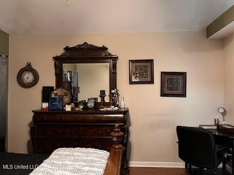 9091 Hunters Ridge Dr, Olive Branch, MS 38654 - bedroom featuring baseboards and wood finished floors