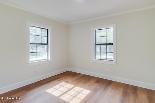 1018 27th St, Gulfport, MS 39501 - unfurnished room with crown molding, wood finished floors, and baseboards