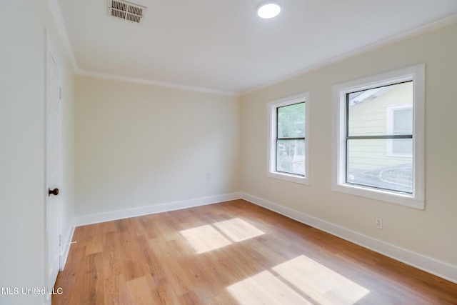 1018 27th St, Gulfport, MS 39501 - spare room with crown molding, baseboards, and light wood finished floors