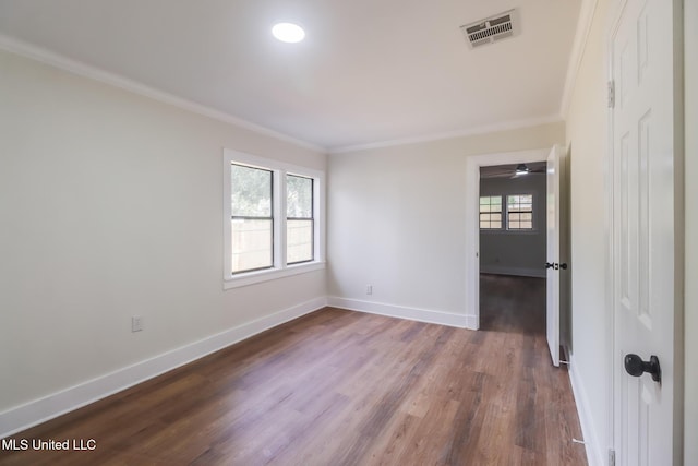 1018 27th St, Gulfport, MS 39501 - unfurnished room featuring crown molding, dark wood-style floors, and baseboards
