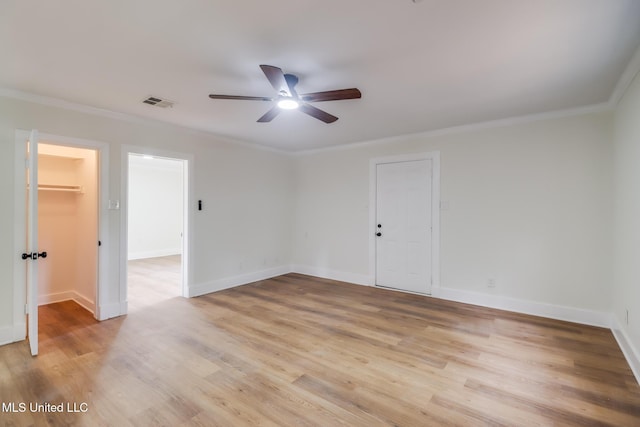 1018 27th St, Gulfport, MS 39501 - unfurnished room with ceiling fan, light wood-style floors, crown molding, and baseboards