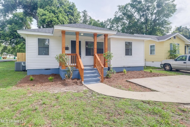1018 27th St, Gulfport, MS 39501 - bungalow-style home with crawl space, roof with shingles, covered porch, and central air condition unit