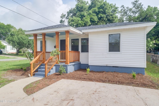 1018 27th St, Gulfport, MS 39501 - bungalow with roof with shingles, crawl space, a porch, and a patio area