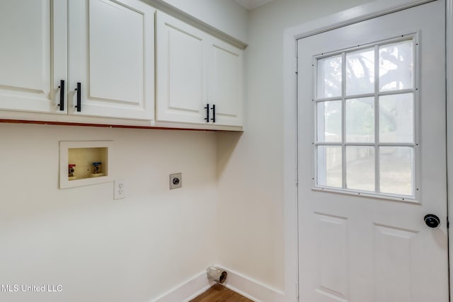 1018 27th St, Gulfport, MS 39501 - washroom with hookup for an electric dryer, cabinet space, washer hookup, baseboards, and plenty of natural light