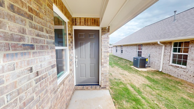 doorway to property featuring central AC