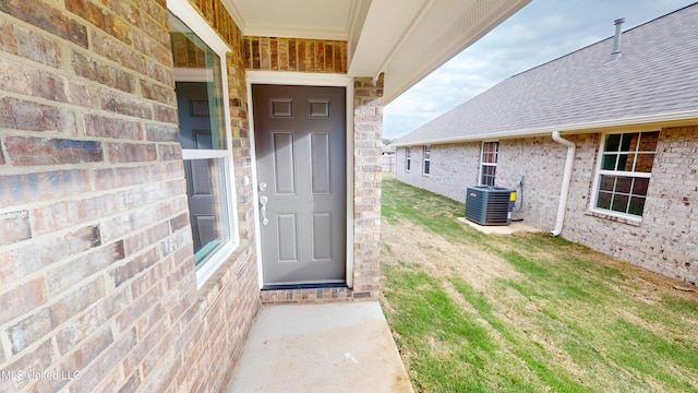 view of exterior entry with central AC