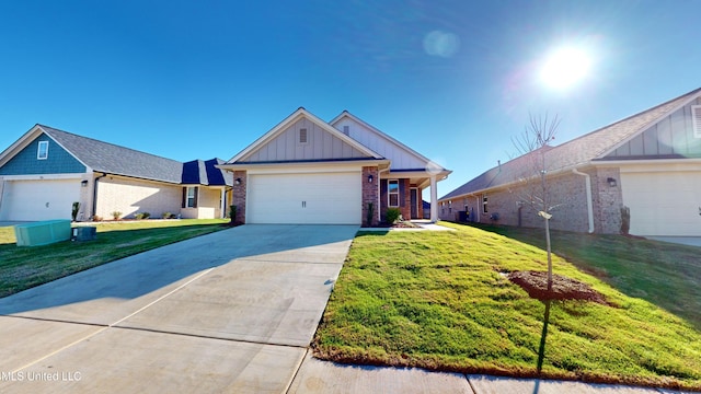 view of front facade featuring cooling unit, a garage, and a front yard