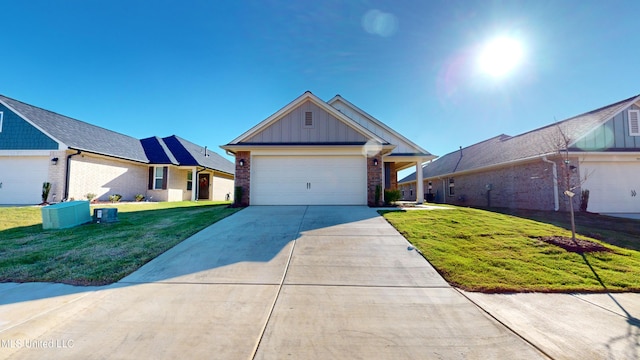 view of front facade with a front yard and a garage