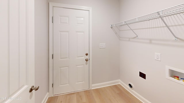 clothes washing area with hardwood / wood-style floors, washer hookup, and hookup for an electric dryer