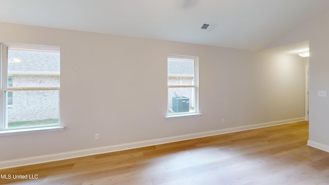 unfurnished room featuring plenty of natural light and light hardwood / wood-style floors