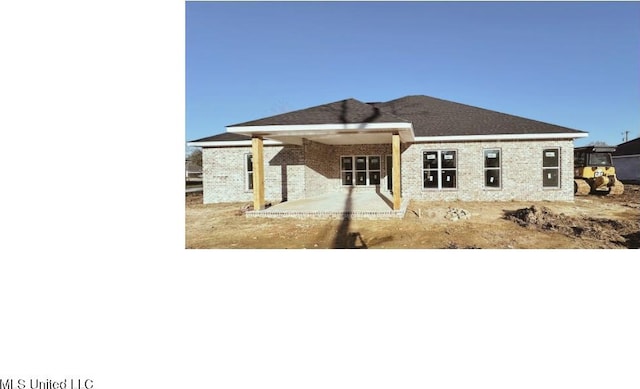 rear view of house featuring a patio