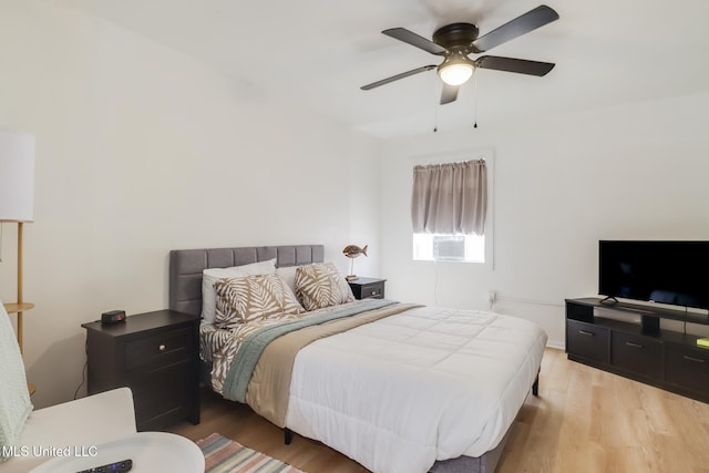 bedroom featuring wood finished floors and ceiling fan