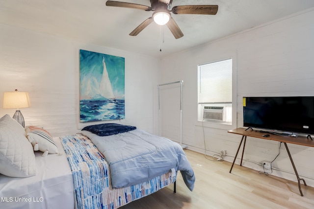 bedroom featuring wood finished floors and ceiling fan