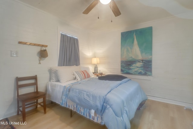 bedroom featuring wood finished floors and ceiling fan