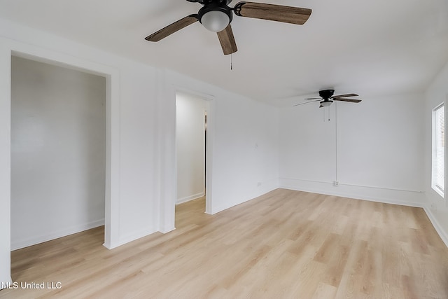 unfurnished room featuring light wood-type flooring and ceiling fan